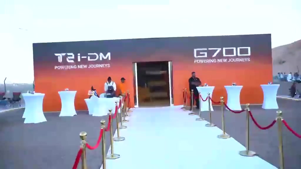 A branded entrance structure at a Jetour event.