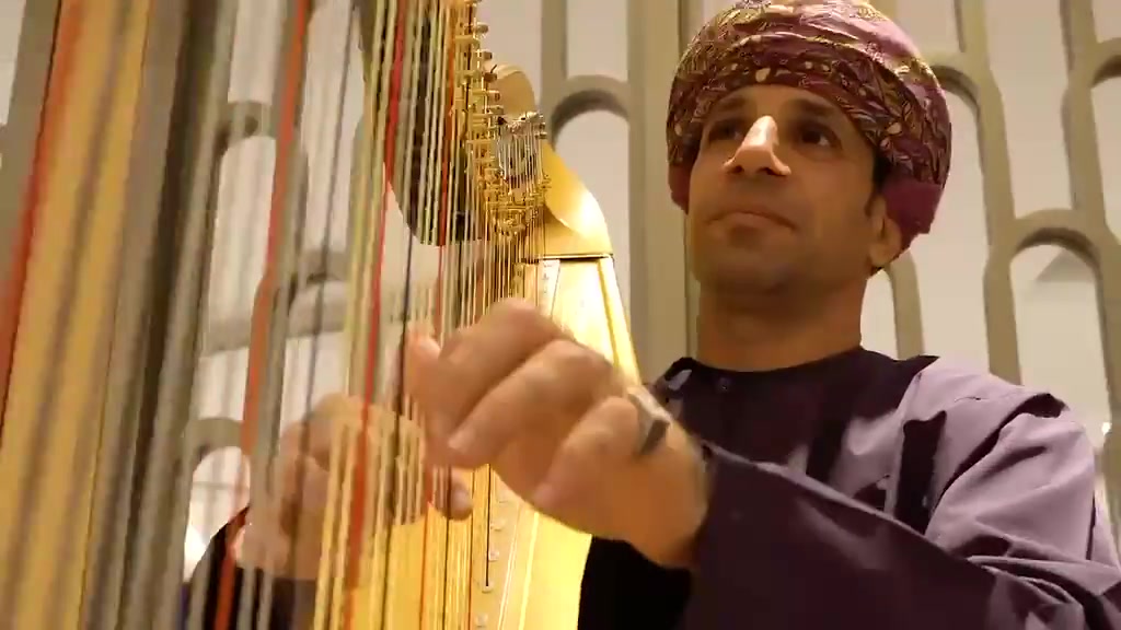 A harpist performing during the HONOR corporate gathering