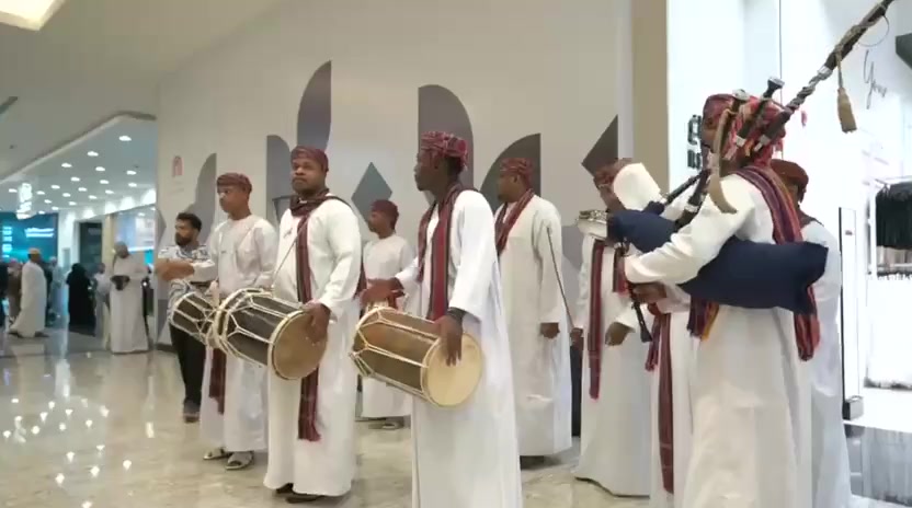 Traditional musicians performing at a Jetour showroom event.
